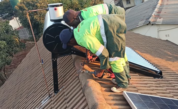 2 men installing Solar Panels, Inverters, Lithium Batteries, Power Pumps, Turbines, Electrical Wiring, Tubing, Solar Geyser and Charge Controller